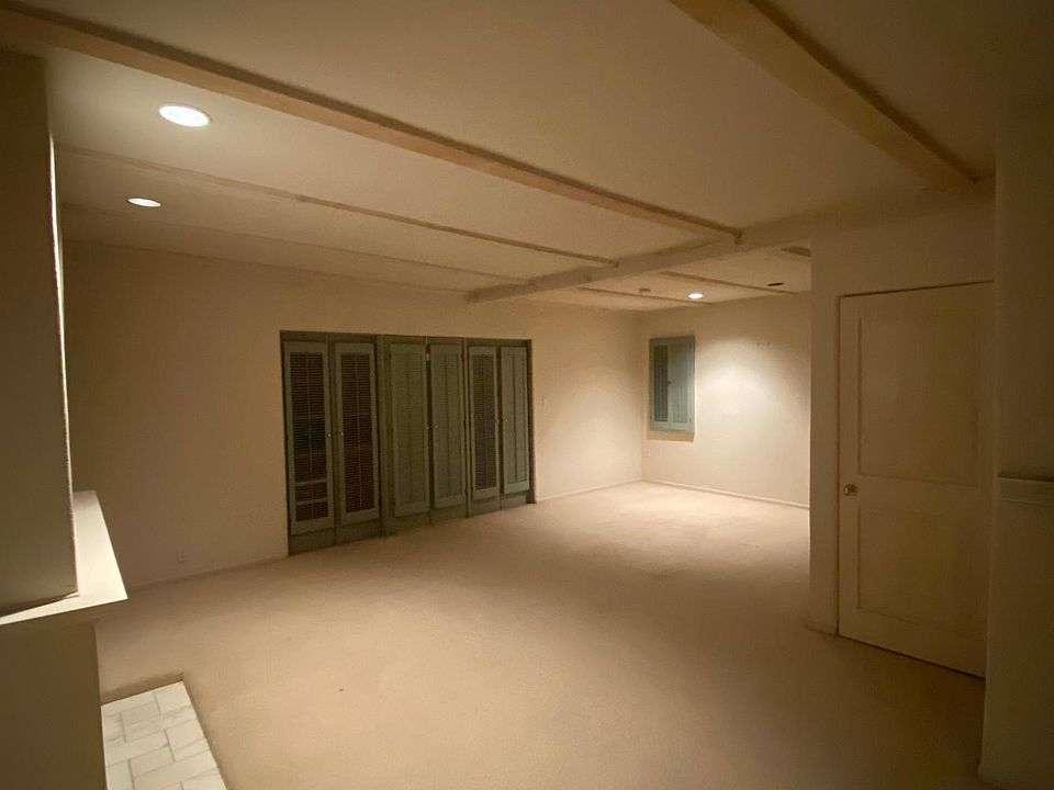 Bedroom with Fireplace + Balcony