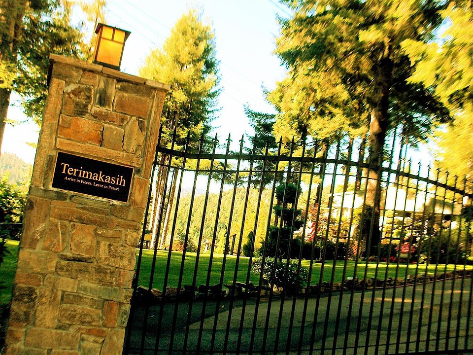 Entrance to property - Stone Columns and Wrought Iron Gates 
Electric Gates with Automatic Genie Operator