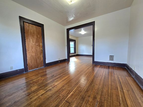 Flexible den space just off the main living area, ideal for a home office, playroom, or cozy sitting area