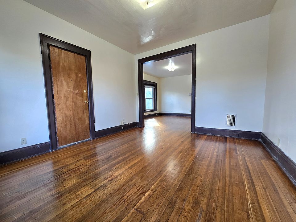 Flexible den space just off the main living area, ideal for a home office, playroom, or cozy sitting area