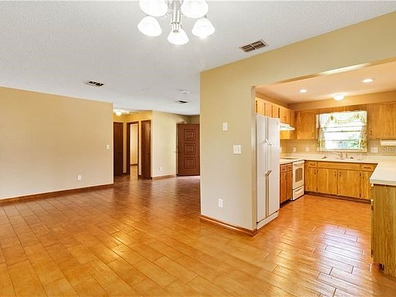 View from dining area to kitchen and living area