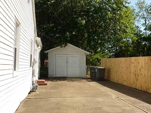 Concrete drive and detached 1 car garage.