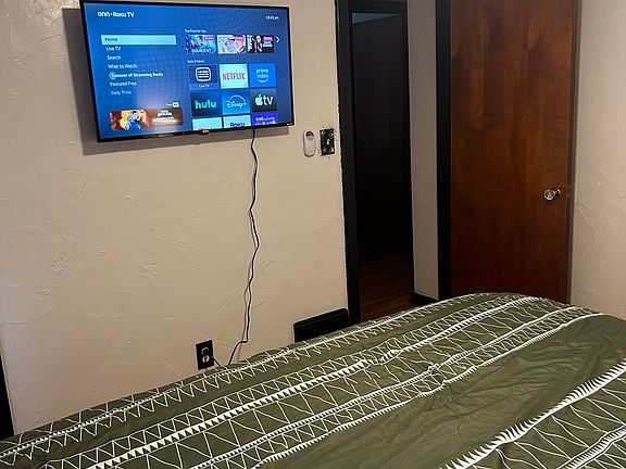 Bedroom1 Showing TV with Roku that you can stream your streaming apps on! (The closet if off to the left of the TV)