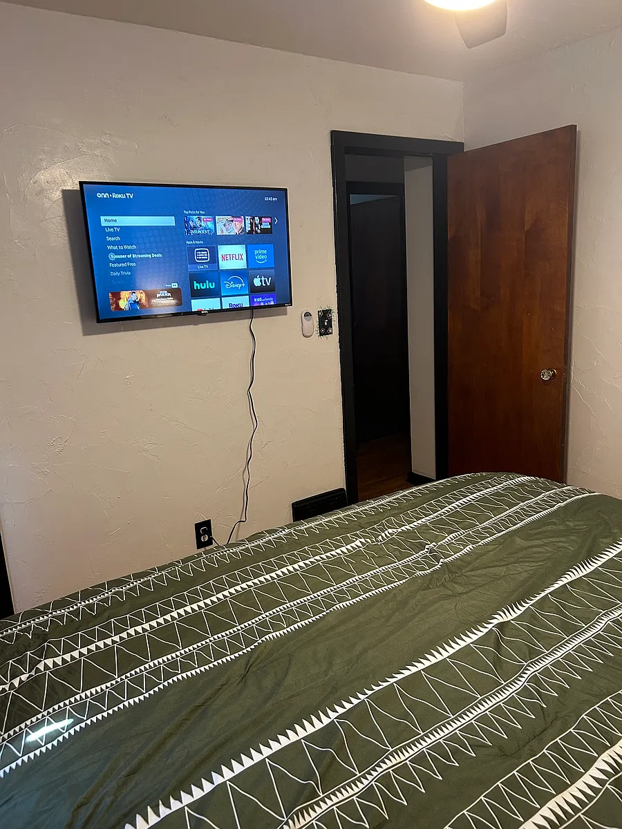 Photo 2 of 6 - 603 16th Ave #1 - Green Bay, WI Bedroom1 Showing TV with Roku that you can stream your streaming apps on! (The closet if off to the left of the TV) - 603 16th Ave #1