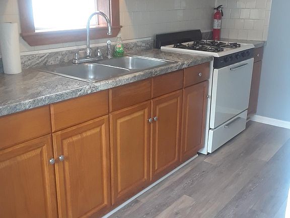Kitchen. New counters and flooring.