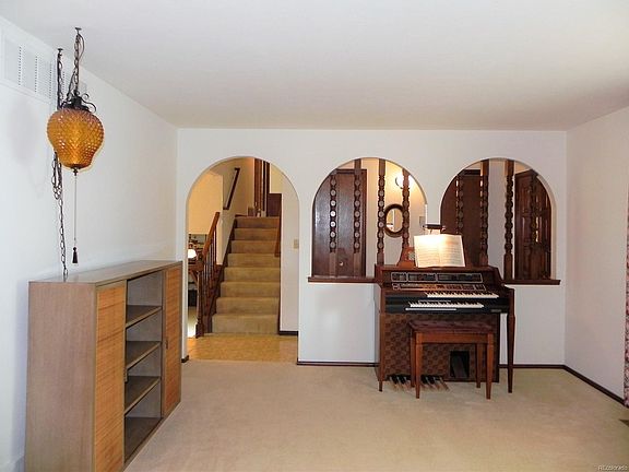 Formal Living Room. Front entrance and two entry closets behind arches.