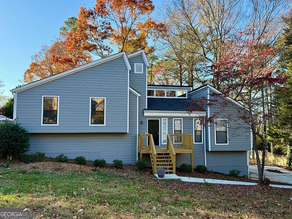 Front of house - all new siding, windows and porch, new driveway and walks