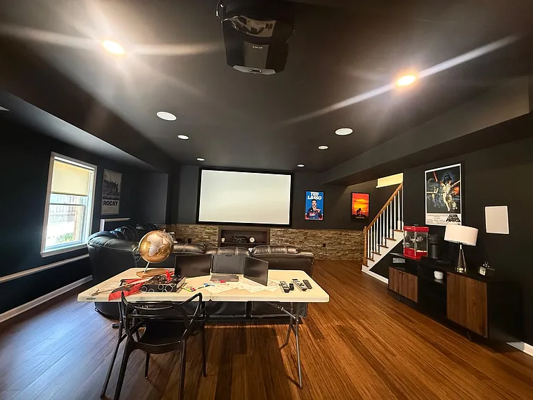 Basement Entertainment Area with Theater and Kitchen