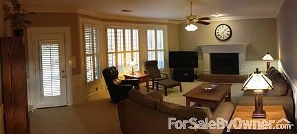 Family room
						:
						Family room with gas fireplace, bay windows and plantation shutters.