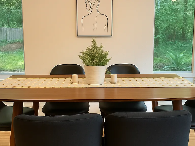 Gather around this modern dining table with tranquil forest views