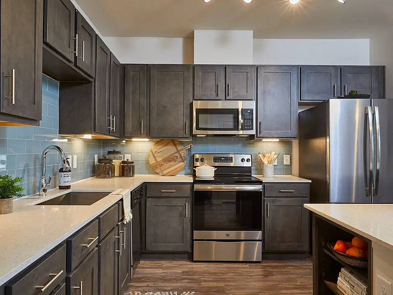 Upgraded Kitchen with Gray Cabinets, Stainless Steel Appliances, Kitchen Island, Backsplash