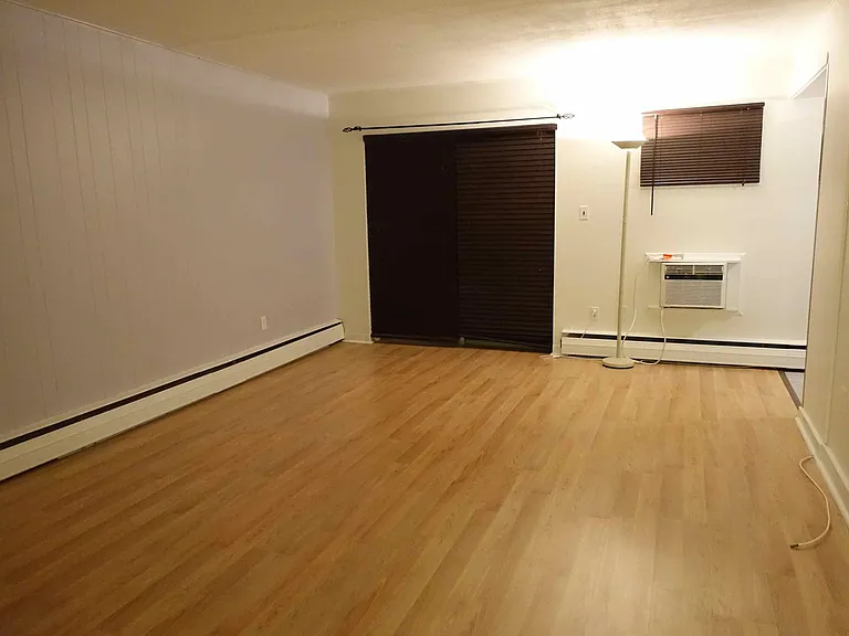 Dining room/Living room, facing private patio. Blinds and A/C included.