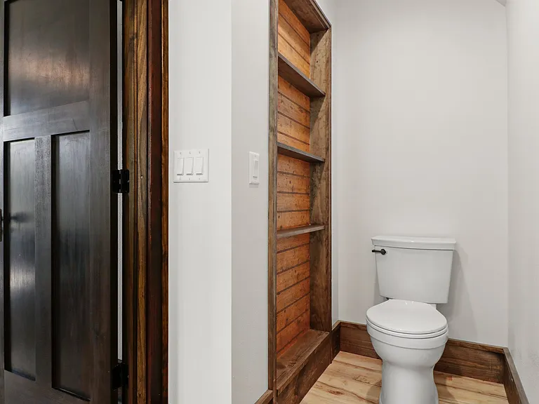 THis is the front bathroom first floor. Lots of storage . It is a full bathroom with a large shower and vanity .