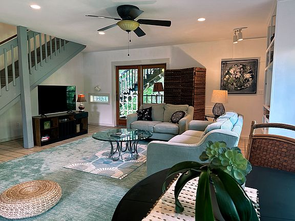 Living room. The deck in view through the glider doors. Upstairs is a family room.