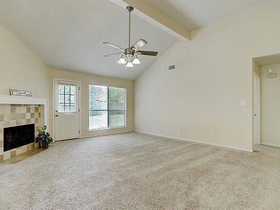Your new family room with a cathedral ceiling which makes a large room feel even roomier!