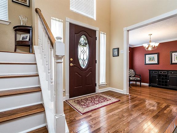 Entry is open to the den and dining with beautiful casings.