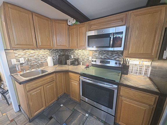 Refrigerator to left 