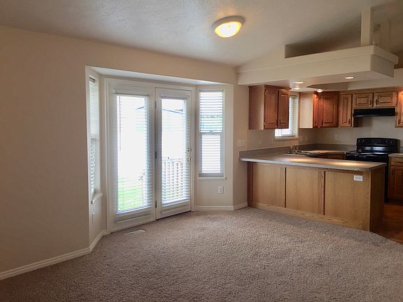 Kitchen and Dining area, looking out to the large back yard.