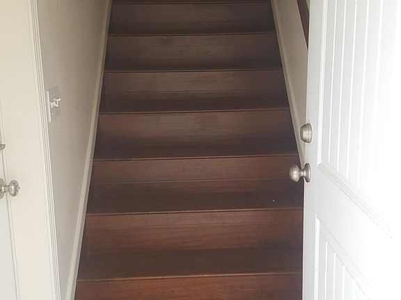 Stairs from entry way to upstairs living areas