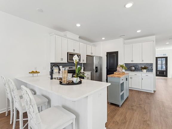 The kitchen of the Morgan townhome model by Brookfield Residential at Wendell Falls.