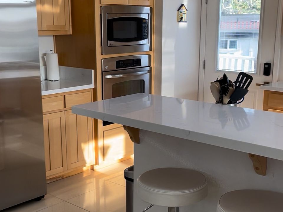 Living-Kitchen-Dining room: Side entrance door (kitchen update in 2023)