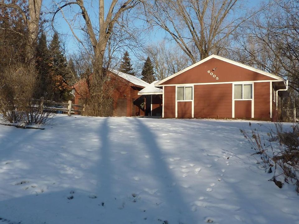 A home in the woods incredible half acre heavily wooded lot convenient location on Plymouth and Maple Grove border.