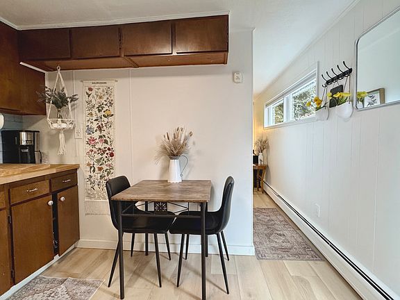 View of the hall leading to the bed/living area. Several windows make the space nice and bright.