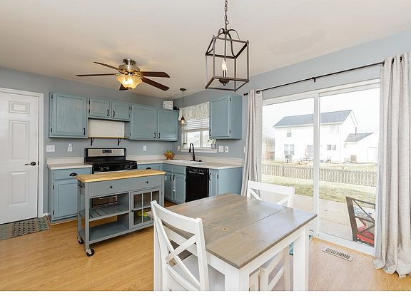 Gorgeous kitchen overlooking fenced backyard.