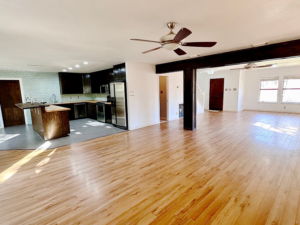 Expansive hall with possibility of 2 separate areas one of which can be office.