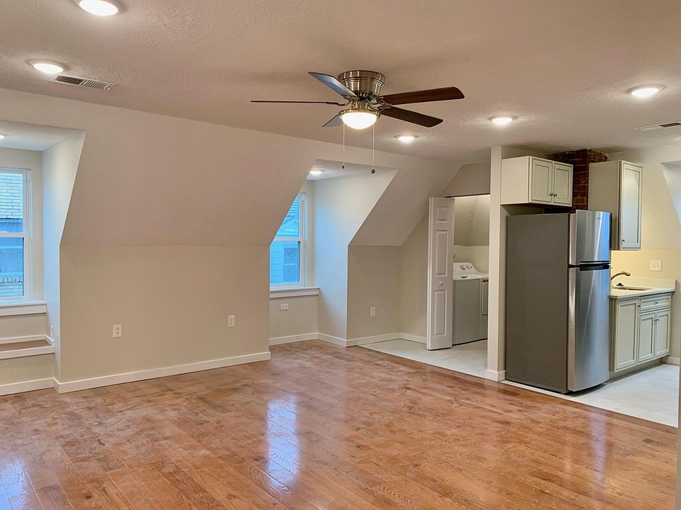 Living room with closet to laundry area