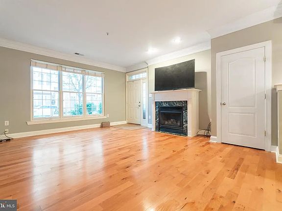 Fireplace and renovated coat closet with cubbies downstairs