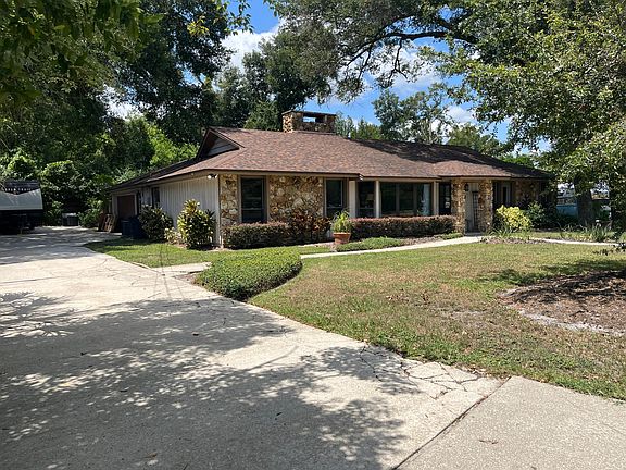 Side view of house, with lengthy driveway