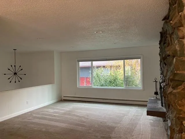 Large Upstairs Living Room With Fireplace