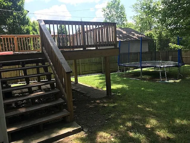Fenced backyard and another view of the deck