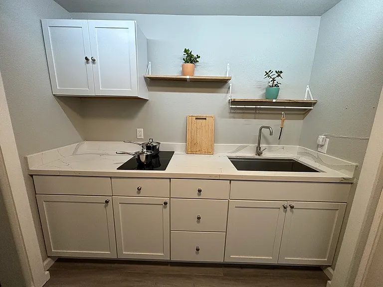 kitchen: double convection stove, large tub sink, plenty of cabinet space. Full refrigerator also included but not pictured.