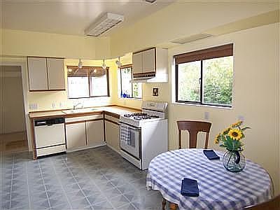 Big open kitchen with eating nook is light and bright.