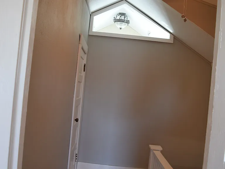 Top of the stairs with lots of light!