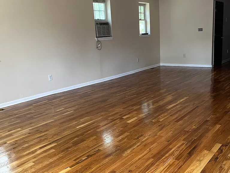 Newly refinished beautiful hardwood floors compliment the open air concept of the living room and dining room.