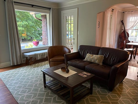 Living Room with Dining Room in background