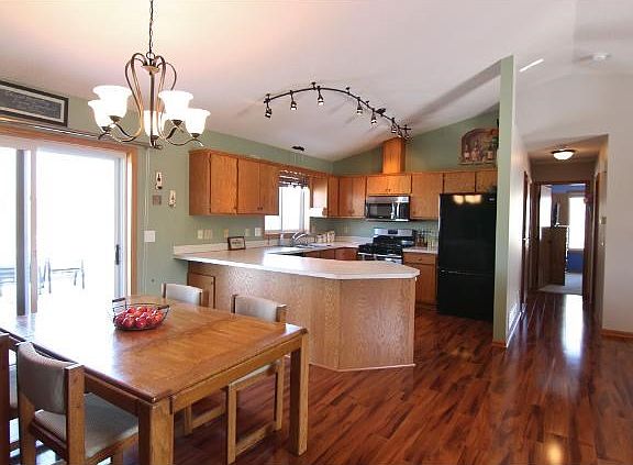 "Island" kitchen features loads of cabinetry. New lighting and oil-rubbed fixtures throughout!