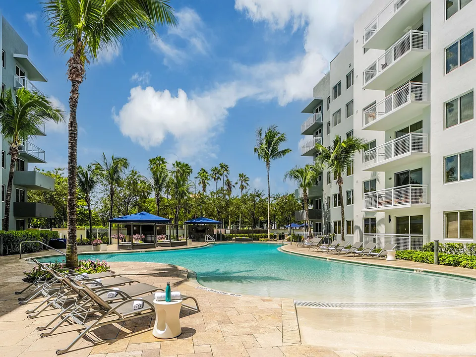 Resort-Style Pool With Lounge Chairs And Cabana