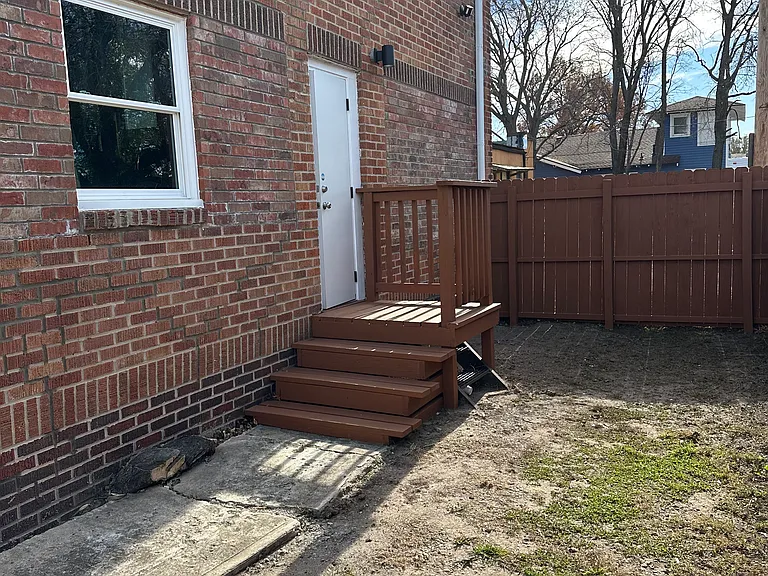 Yard space partially fenced.