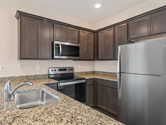 The kitchen comes with a full suite of stainless steel appliances