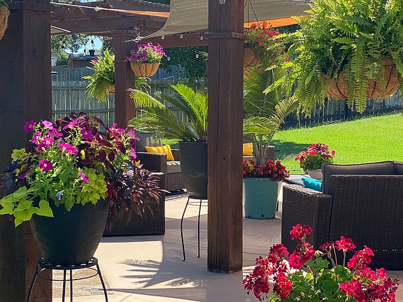 Two pergolas with plenty of outdoor furniture