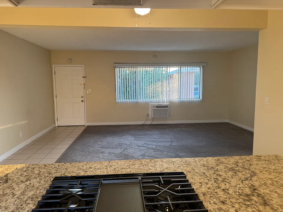 Standing in the kitchen looking towards living room. Very open floor plan.