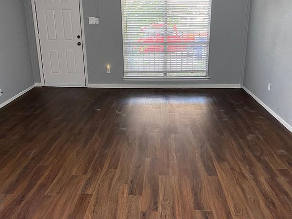 Living/Dining area with blinds open.