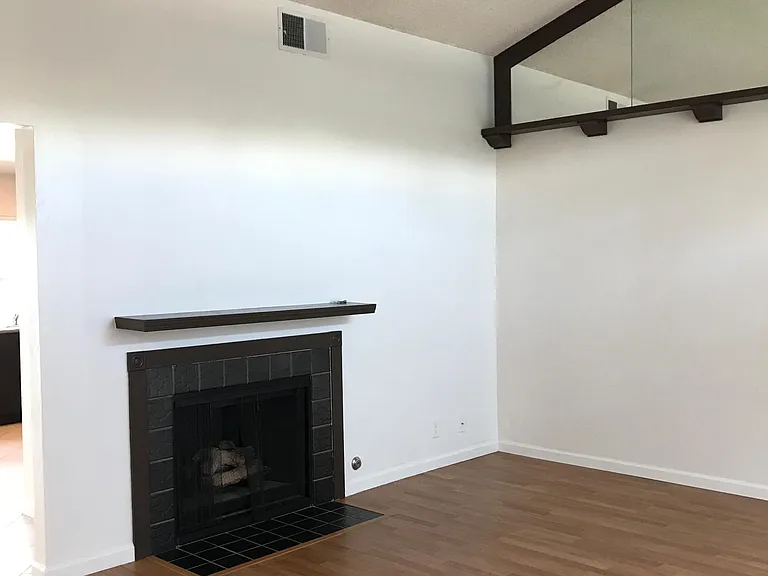 Living room view with gas fire place