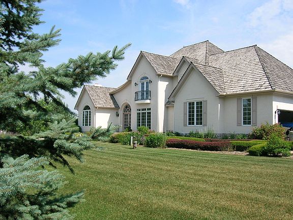 Nestled in 2 1/2 area wooded lot