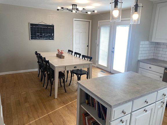French doors lead to the upper deck with privacy and great views of the green space.