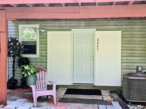 Back entrance that leads to additional parking spaces.